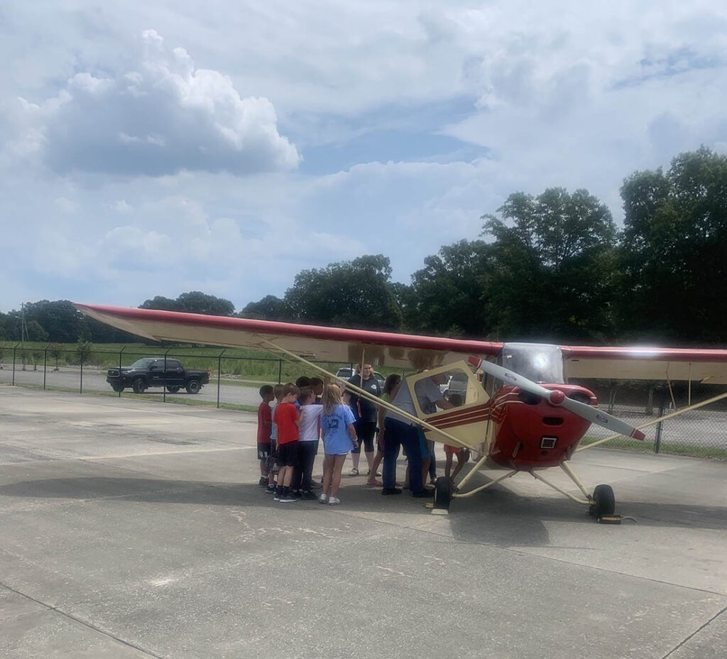 Ron Gilmer Showing The Inner Workings Of An Aeronca Champ To School Class